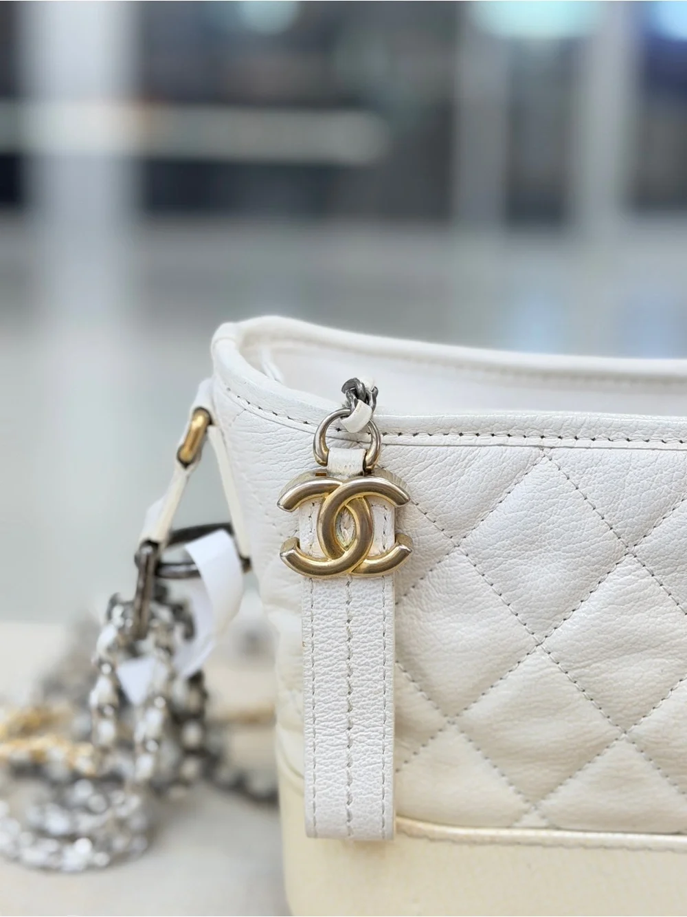 CHANEL White Quilted Leather Crossbody with Mixed Metal Chain and CC Charm
